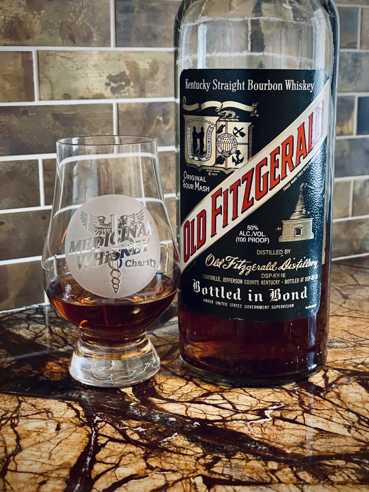 Old Fitzgerald Bottled in Bond DSP-KY-16 poured in a Medicinal Whiskey Charity Glencairn